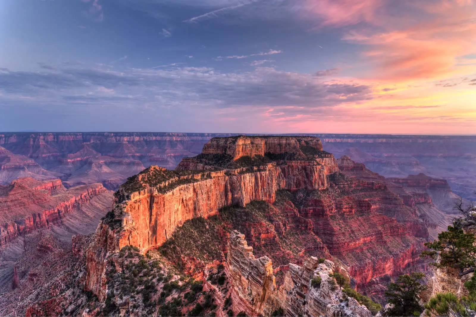 Wotans Throne and the Grand Canyon's North Rim glowing in sunset light from Cape Royal
